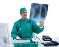 Charming surgeon looking at X-ray Royalty Free Stock Photo