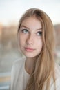 Charming teen girl is rolling her eyes up and looking Royalty Free Stock Photo