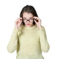 Charming teenage girl dresses glasses for vision.