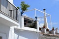 Charming terrace and chimney with plants in Frigiliana, Spanish white village Andalusia