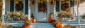 A charming Thanksgiving themed front porch with pumpkins, wreaths, and seasonal flowers Royalty Free Stock Photo