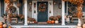 A charming Thanksgiving themed front porch with pumpkins, wreaths, and seasonal flowers Royalty Free Stock Photo