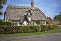 Charming thatched roof house in the Cotswolds English countrysi Royalty Free Stock Photo