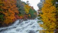 Charming view of fresh flowing river among beautiful colorful autumn trees for background