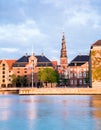 Charming view of the houses and spire of Our Savior Church on the waterfront of Copenhagen, Denmark. Exotic amazing places.