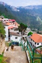 Charming village of Guapolo in Quito Ecuador with houses built downward valley, spectacular view Andes mountains