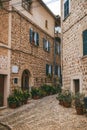 Charming village street with historic stone houses in Fornalutx