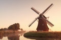 charming windmill and river at sunrise