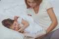 Charming woman reading a book to her little daughter Royalty Free Stock Photo