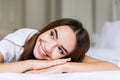 Charming woman smile face close up and she lying on the bed in the morning Royalty Free Stock Photo