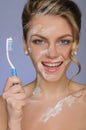 Charming woman with toothbrush and toothpaste