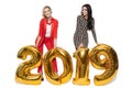 Charming Women Holding Big Golden Numbers 2019. Happy New Year. Royalty Free Stock Photo