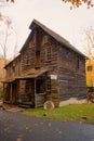 Charming wooden building situated on a corner of a road in a picturesque autumnal setting