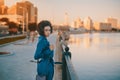 Brazilian girl in blue derss near river