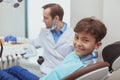 Charming young boy getting teeth checkup at the dentist Royalty Free Stock Photo