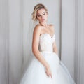 Charming young bride in luxurious wedding dress. Pretty girl, the photo Studio Royalty Free Stock Photo