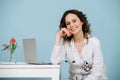 Charming young doctor waiting for a patient in her office, looking at camera Royalty Free Stock Photo