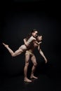 Charming young gymnasts performing together in the studio