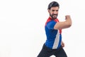 charming young Latino man in Cuban flag T-shirt danceing cowboy shot studio shot copy space Royalty Free Stock Photo