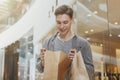 Handsome young man shopping at the mall Royalty Free Stock Photo