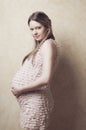 Charming young pregnant in beautiful pink dress Royalty Free Stock Photo