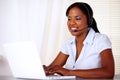 Charming young secretary working on laptop