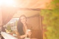 Charming young woman enjoying tea in cafe Royalty Free Stock Photo