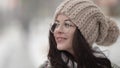charming young woman with glasses and nice knitted hat is walking at winter, closeup portrait Royalty Free Stock Photo