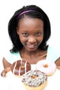 Charming young woman looking at donuts Royalty Free Stock Photo