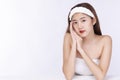 Charming woman wear headband touching her face with clean fresh body. Teenager before bathing while looking at camera over