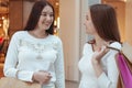 Young women enjoying shopping together at the mall