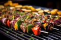 charred beef skewers with colorful veggies on grill Royalty Free Stock Photo