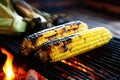 charred corn on the cob on a bamboo mat