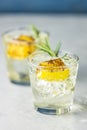 Charred Lemon, Rosemary and Coriander Gin and Tonic is a flavors are perfectly balanced refreshing cocktail. on light background, Royalty Free Stock Photo