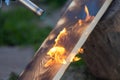 Charred wooden planks and fire. Background, texture. Flame.