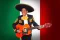 Charro Mariachi playing guitar in Mexico flag
