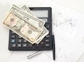 Chart, calculator, pen. Dollars. Royalty Free Stock Photo