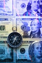 Chart graph spreadsheet on US dollar banknotes money with compass. Choosing the direction. Royalty Free Stock Photo