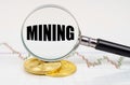 On the chart with quotes are bitcoins and there is a magnifying glass with the inscription - Mining