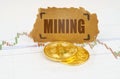 On the chart with quotes, there are bitcoins and there is a sign with the inscription - Mining