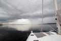 Charter Catamaran on Calm Water Before Rain Storm