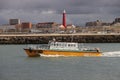 Charter fishing boat is leaving the harbor of Scheveningen