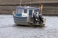 Charter Fishing Boat at low tide Royalty Free Stock Photo