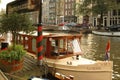 Charterboat moored on a canal in Amsterdam Royalty Free Stock Photo