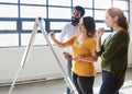 Charting their success. a group of businesspeople brainstorming together in an office.