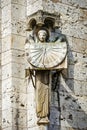 Statue of angel holding sundial at Cathedral in Chartres, France