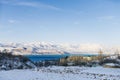 Charvak mountain lake in Uzbekistan on a snowy frosty day, surrounded by the Tien Shan mountains Royalty Free Stock Photo