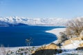 Charvak reservoir in winter in Uzbekistan and a lone tree. Beautiful winter landscape. The Tien Shan mountain system in Central Royalty Free Stock Photo