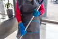 charwoman in apron and gloves, cleaning Royalty Free Stock Photo