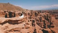 Charyn canyon and a young couple. A girl in a white dress, a guy in a shirt and jeans.